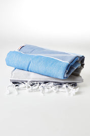 A model wearing size OneSize of the Hammamas Calypso Cotton Towel in colour Blues (Blue), from the front, showing the whole outfit