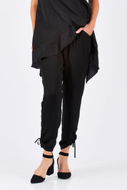 Model Louise wearing size 10 of the Luxe Pant in colour Black (Black), from the front, cropped image