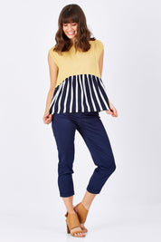 Model Edith wearing size 10 of the Sleeveless Tank in colour Sunset (Blue), from the front, showing the whole outfit
