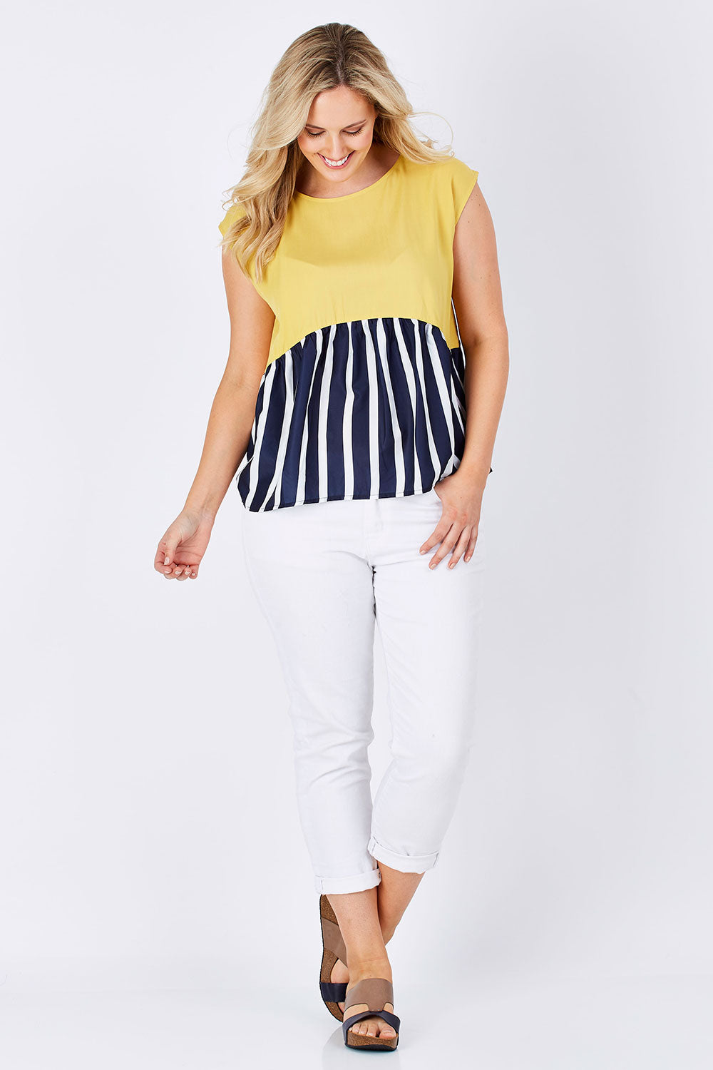 Model Jess wearing size 12 of the Sleeveless Tank in colour Sunset (Blue), from the front, showing the whole outfit