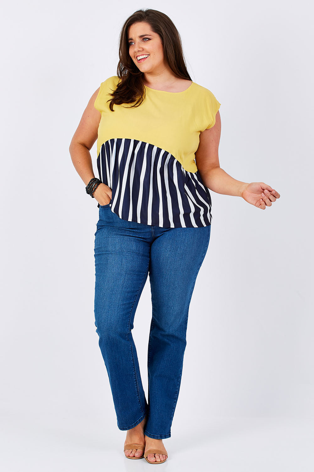 Model Mae wearing size 16 of the Sleeveless Tank in colour Sunset (Blue), from the front, showing the whole outfit