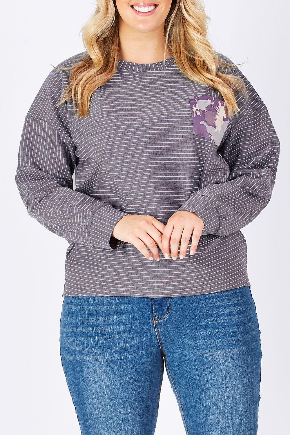 Model Jess wearing size 14 of the Contrast Stripe Sweater in colour Pockets (Grey), from the front, cropped image