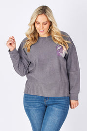 Model Jess wearing size 14 of the Contrast Stripe Sweater in colour Pockets (Grey), from the front, cropped image