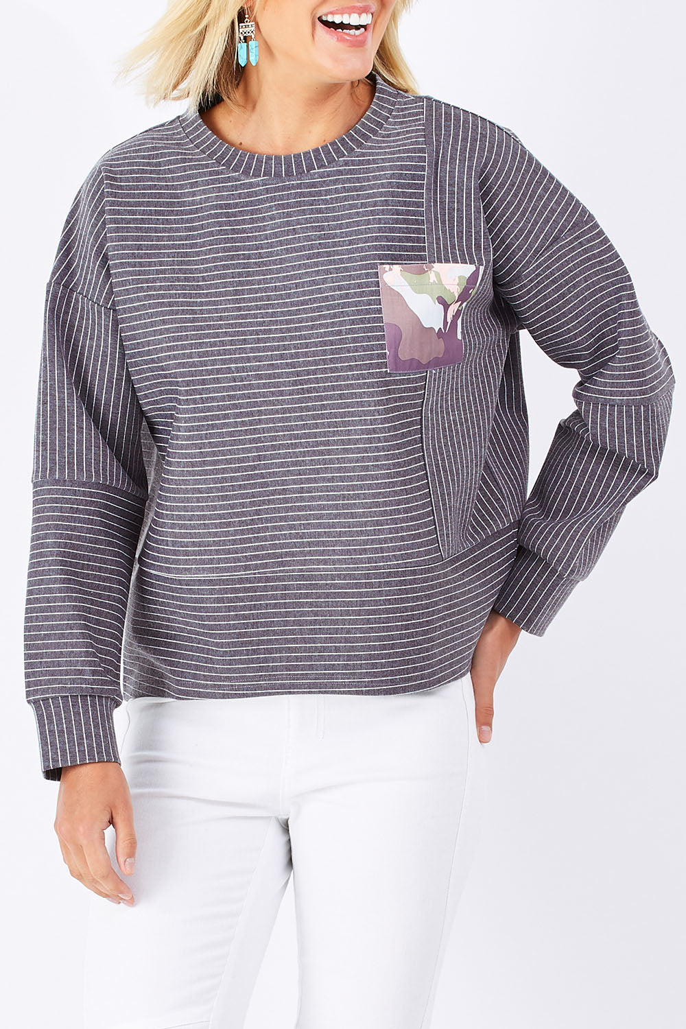 Model Jude wearing size 10 of the Contrast Stripe Sweater in colour Pockets (Grey), from the front, cropped image