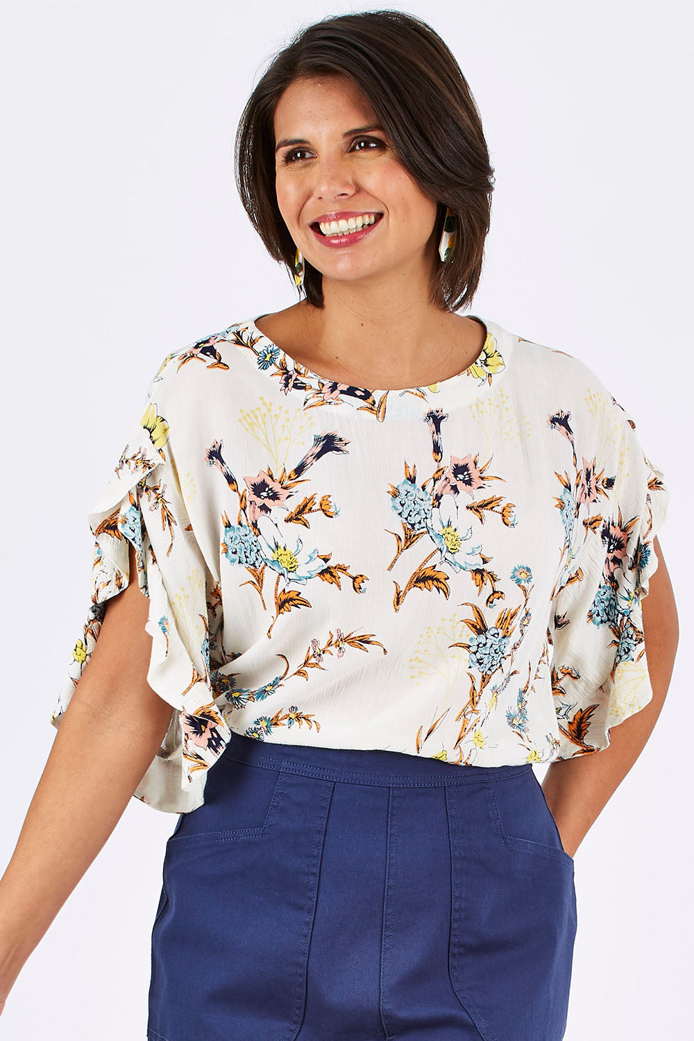 Model Thais wearing size 10 of the Soft Sleeve Top in colour Trumpet (White), from the front, cropped image