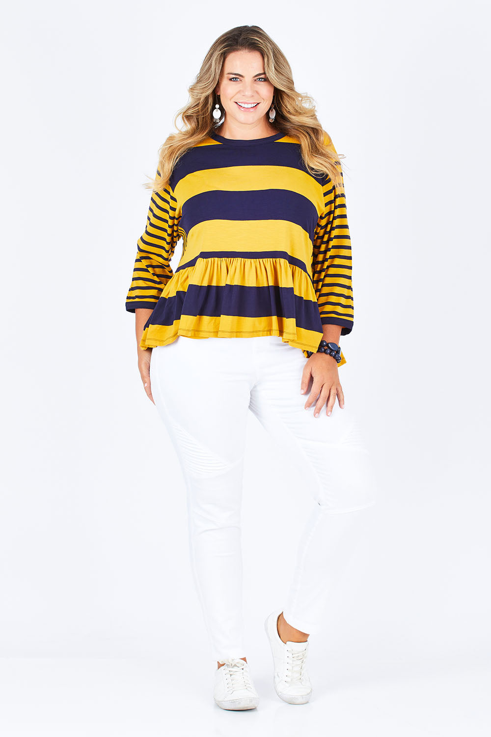 Model Fiona wearing size 16 of the Hem Frill Stripe Top in colour SoFrilled (Blue), from the front, showing the whole outfit