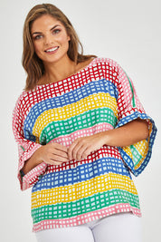 Model Monique wearing size 14 of the Tie Back Bell Sleeve Top in colour Hopscotch (Pink), from the front, cropped image