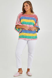 Model Monique wearing size 14 of the Tie Back Bell Sleeve Top in colour Hopscotch (Pink), from the front, showing the whole outfit