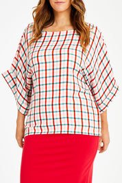 Model Laura wearing size 14 of the Tie Back Bell Sleeve Top in colour Check (White), from the front, cropped image