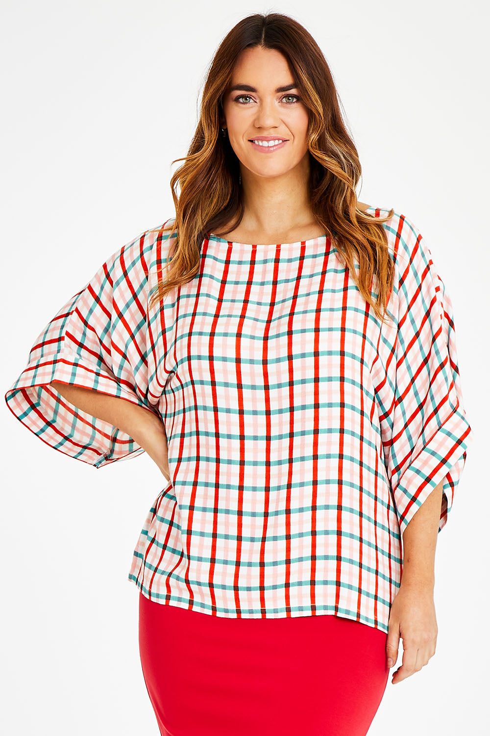 Model Laura wearing size 14 of the Tie Back Bell Sleeve Top in colour Check (White), from the front, cropped image