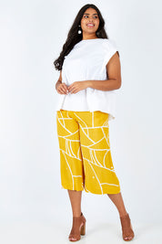 Model Shanaya wearing size 14 of the Geo Print Pant in colour Geo, from the front, showing the whole outfit