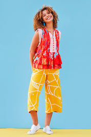 Model Summer wearing size 10 of the Geo Print Pant in colour Geo, from the front, showing the whole outfit