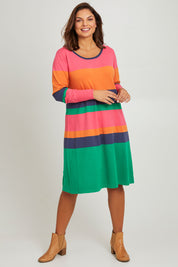 Model Monique wearing size L of the Knit Stripe Dress in colour Multihues (Pink), from the front, showing the whole outfit