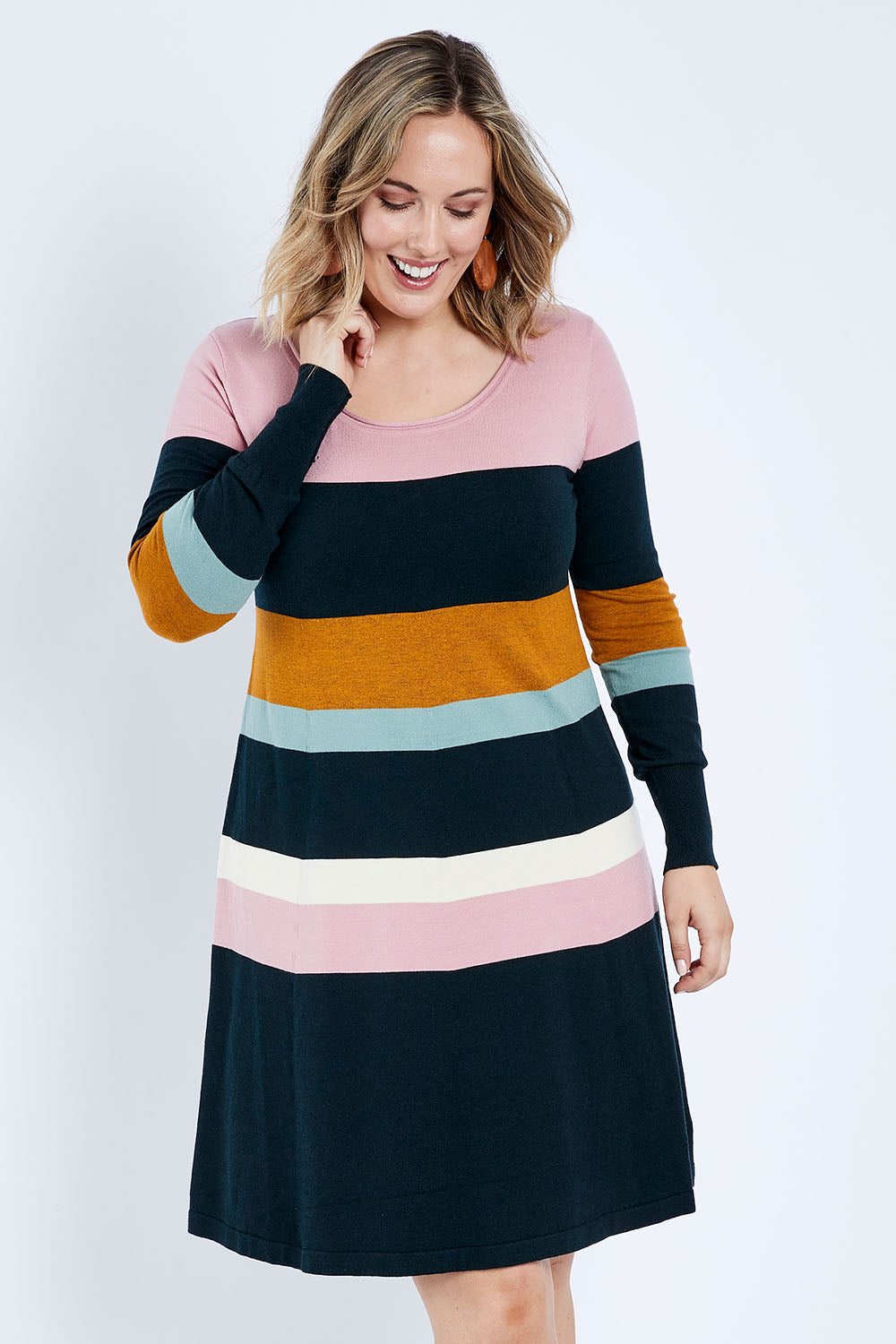 Model Jess wearing size L of the Knit Stripe Dress in colour Mixstripe (Green), from the front, cropped image