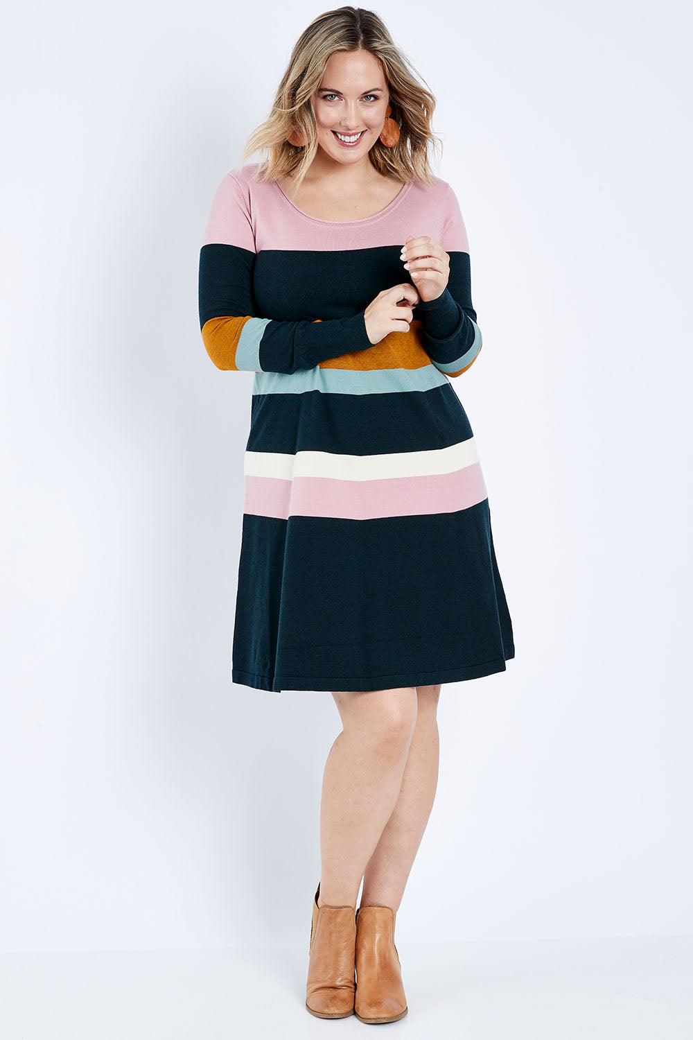 Model Jess wearing size L of the Knit Stripe Dress in colour Mixstripe (Green), from the front, showing the whole outfit