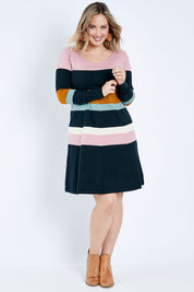 Model Jess wearing size L of the Knit Stripe Dress in colour Mixstripe (Green), from the front, showing the whole outfit