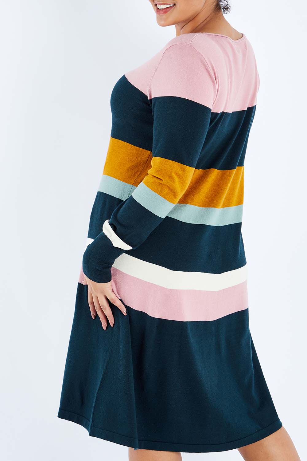 Model Sasha-Lee wearing size XL of the Knit Stripe Dress in colour Mixstripe (Green), from the back