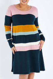 Model Sasha-Lee wearing size XL of the Knit Stripe Dress in colour Mixstripe (Green), from the front, cropped image