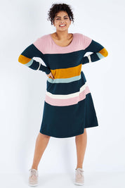 Model Sasha-Lee wearing size XL of the Knit Stripe Dress in colour Mixstripe (Green), from the front, showing the whole outfit