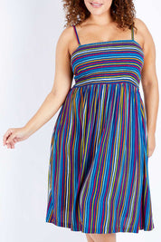 Model Jess wearing size 16 of the Shirred Bodice Dress in colour Evrystripe (Blue), from the front, cropped image
