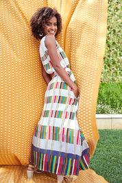 Model Narrah wearing size 10 of the Tie Waist Maxi Dress in colour Coded (Grey), from the front, showing the whole outfit