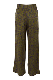 Product shot of the Printed Wide Leg Pant in colour Mustspots (Black), from the back