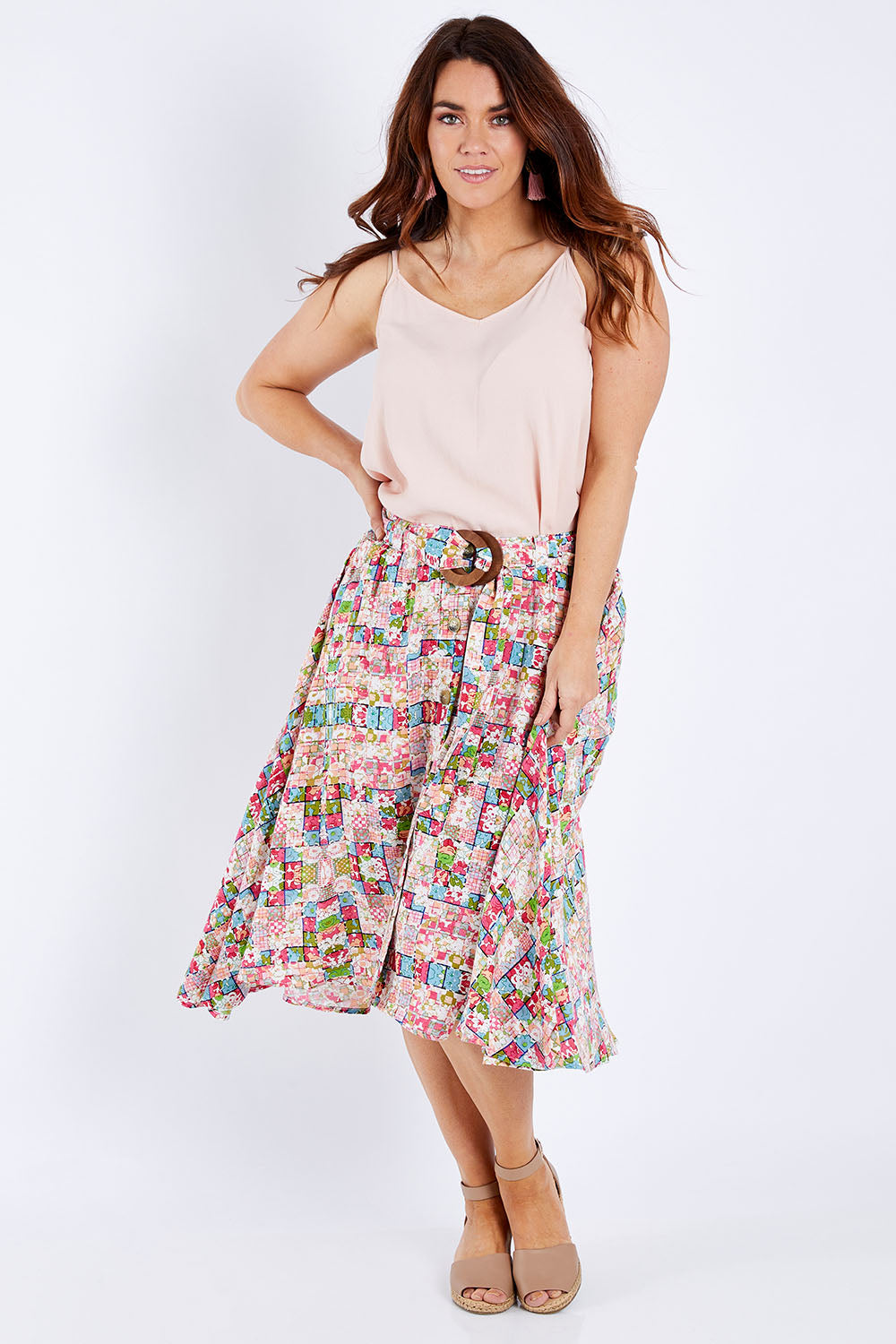 Model Laura wearing size 14 of the Belted Button Skirt in colour Patchmeup (Pink), from the front, showing the whole outfit