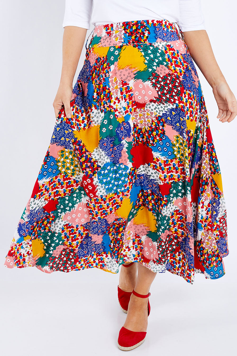 Model Laura wearing size 14 of the Patchwork Maxi Skirt in colour Patched (Red), from the front, cropped image