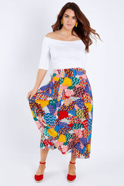 Model Laura wearing size 14 of the Patchwork Maxi Skirt in colour Patched (Red), from the front, showing the whole outfit