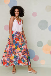 Model Schanez wearing size 10 of the Patchwork Maxi Skirt in colour Patched (Red), from the front, showing the whole outfit