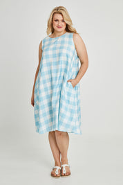 Model Keeara wearing size 16 of the Gingham Swing Dress in colour Gingham (Blue), from the front, showing the whole outfit