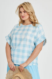 Model Keeara wearing size 16 of the Gingham Top in colour Gingham (Blue), from the front, cropped image
