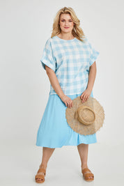 Model Keeara wearing size 16 of the Gingham Top in colour Gingham (Blue), from the front, showing the whole outfit