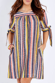 Model Laura wearing size 14 of the Striped Tie Sleeve Dress in colour Tribal (Blue), from the front, cropped image