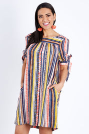 Model Pamela wearing size 10 of the Striped Tie Sleeve Dress in colour Tribal (Blue), from the front, cropped image