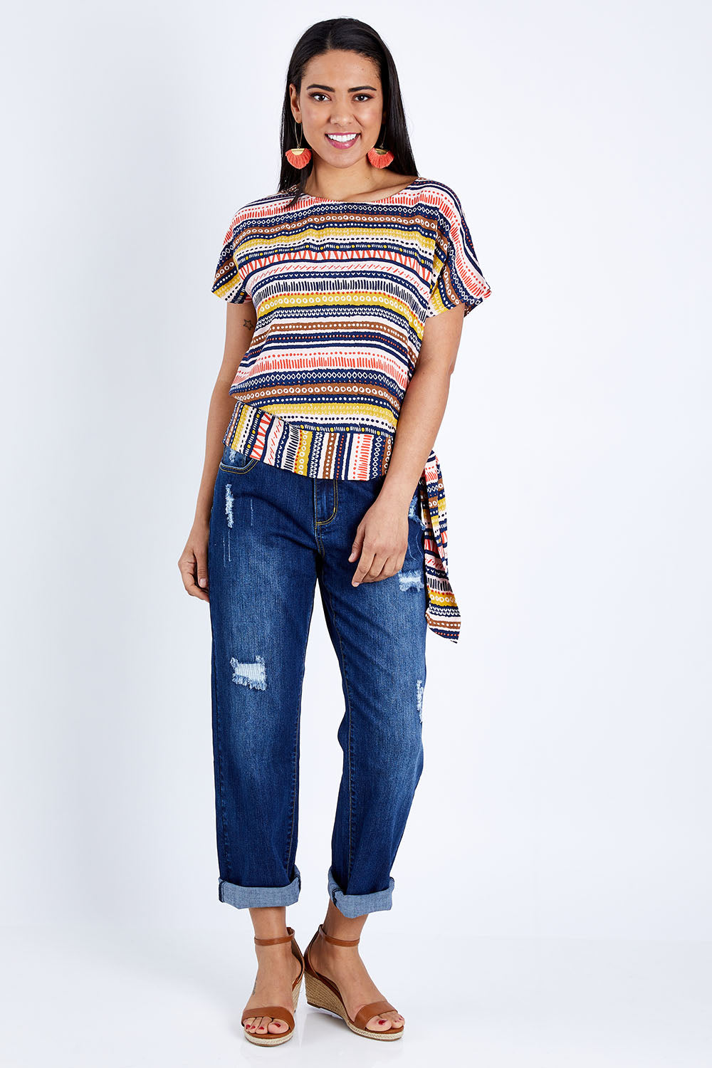 Model Pamela wearing size 10 of the Striped Tie Waist Top in colour Tribal (Blue), from the front, showing the whole outfit