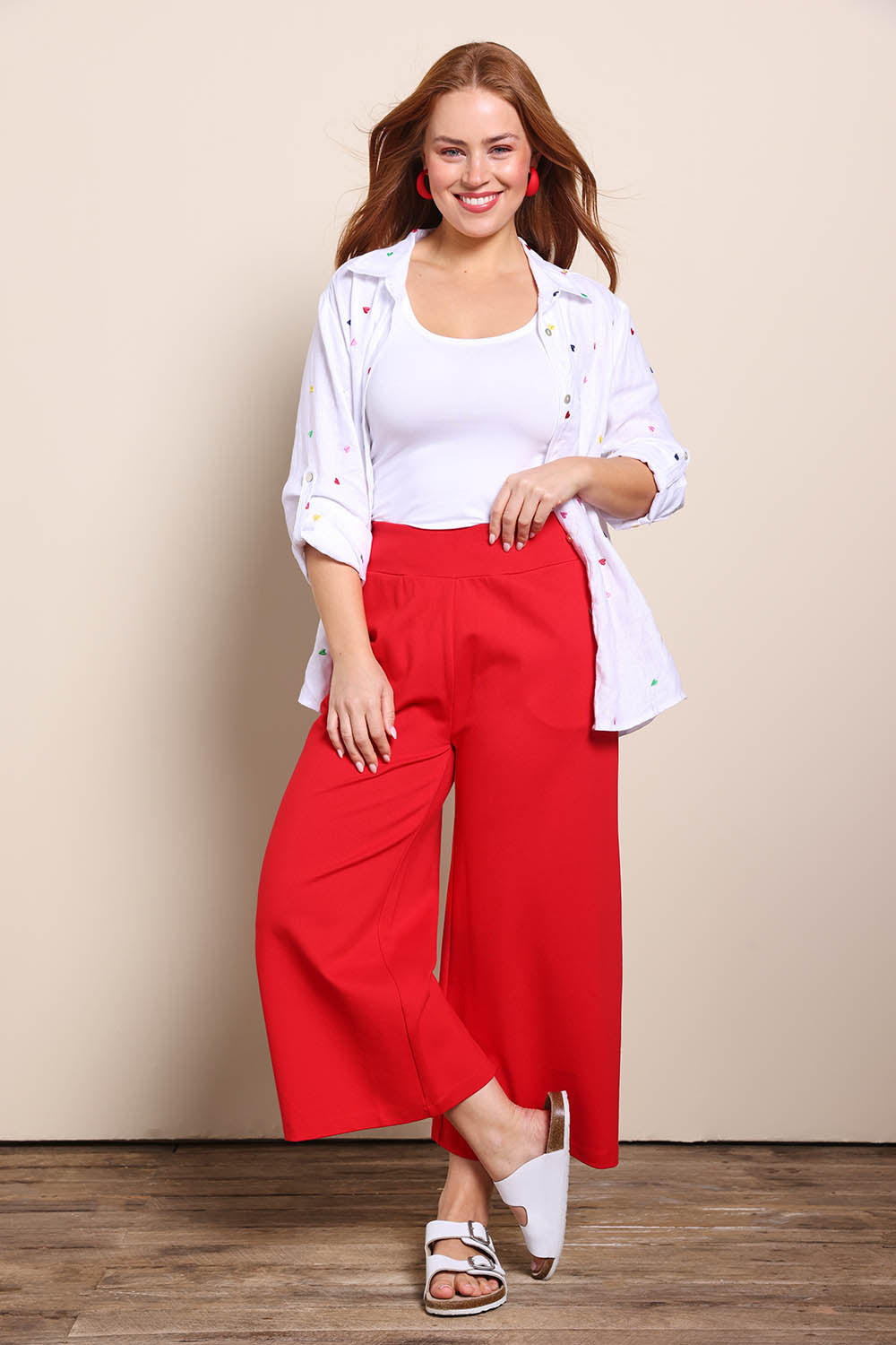 Model Georgiel wearing size 10 of the Wide Leg Ponte Pant – Brightred in colour Brightred, from the front