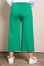 Model Georgiel wearing size 10 of the Wide Leg Ponte Pant – Green in colour Green, from the back