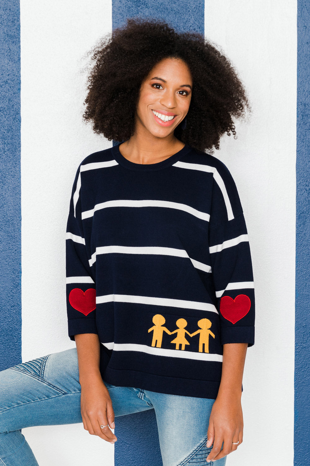 Model Schanez wearing size S of the Together Sweater in colour Together (Blue), from the front, showing the whole outfit
