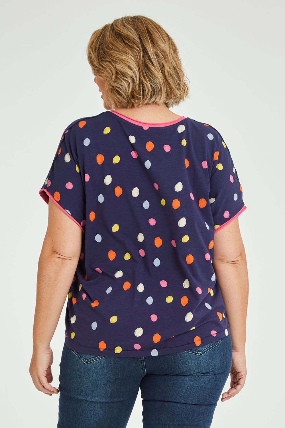 Model Fiona wearing size 16 of the Multi Spot Tee in colour Multispot (Blue), from the back