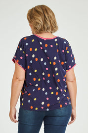 Model Fiona wearing size 16 of the Multi Spot Tee in colour Multispot (Blue), from the back