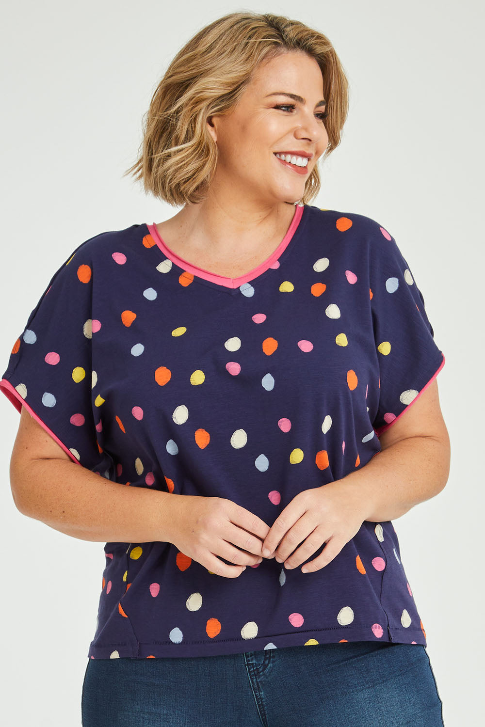 Model Fiona wearing size 16 of the Multi Spot Tee in colour Multispot (Blue), from the front, cropped image