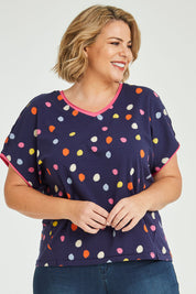 Model Fiona wearing size 16 of the Multi Spot Tee in colour Multispot (Blue), from the front, cropped image