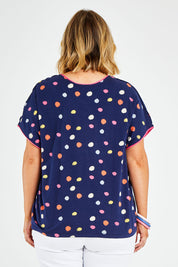 Model Jess wearing size 14 of the Multi Spot Tee in colour Multispot (Blue), from the back