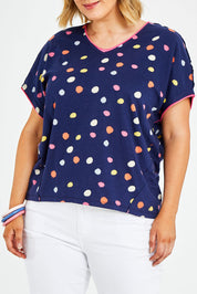 Model Jess wearing size 14 of the Multi Spot Tee in colour Multispot (Blue), from the front, cropped image