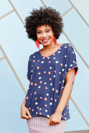 Model Olivia wearing size 10 of the Multi Spot Tee in colour Multispot (Blue), from the front, showing the whole outfit