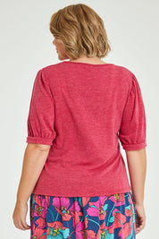 Model Fiona wearing size 16 of the Gathered Sleeve Top in colour Hotpink (Pink), from the back