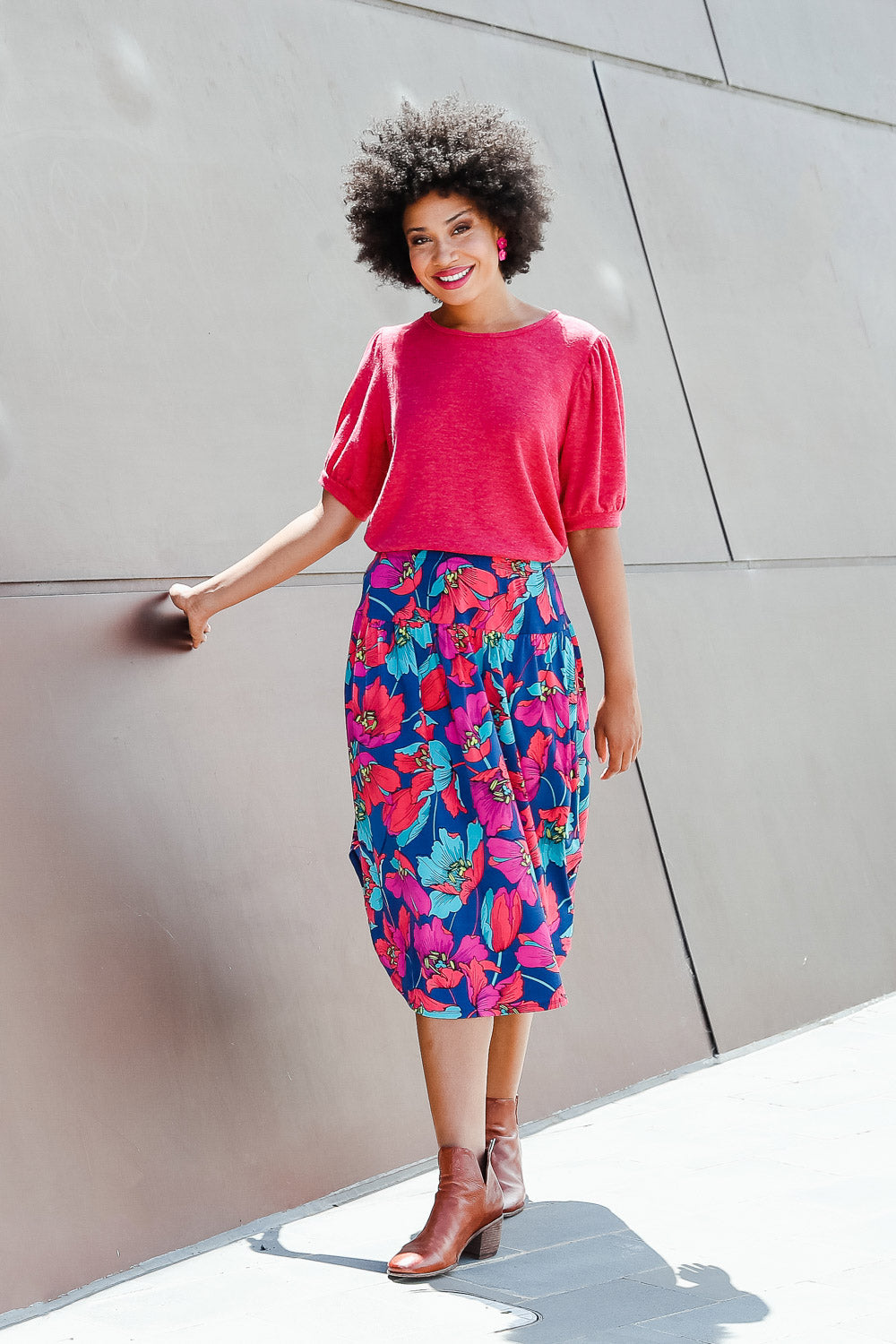 Model Olivia wearing size 10 of the Gathered Sleeve Top in colour Hotpink (Pink), from the front, showing the whole outfit