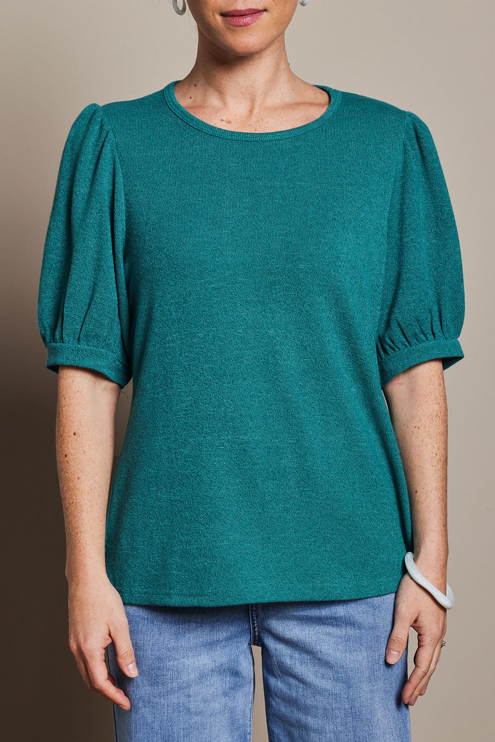 Model Katie wearing size 10 of the Gathered Sleeve Top in colour Jade (Green), from the front, cropped image