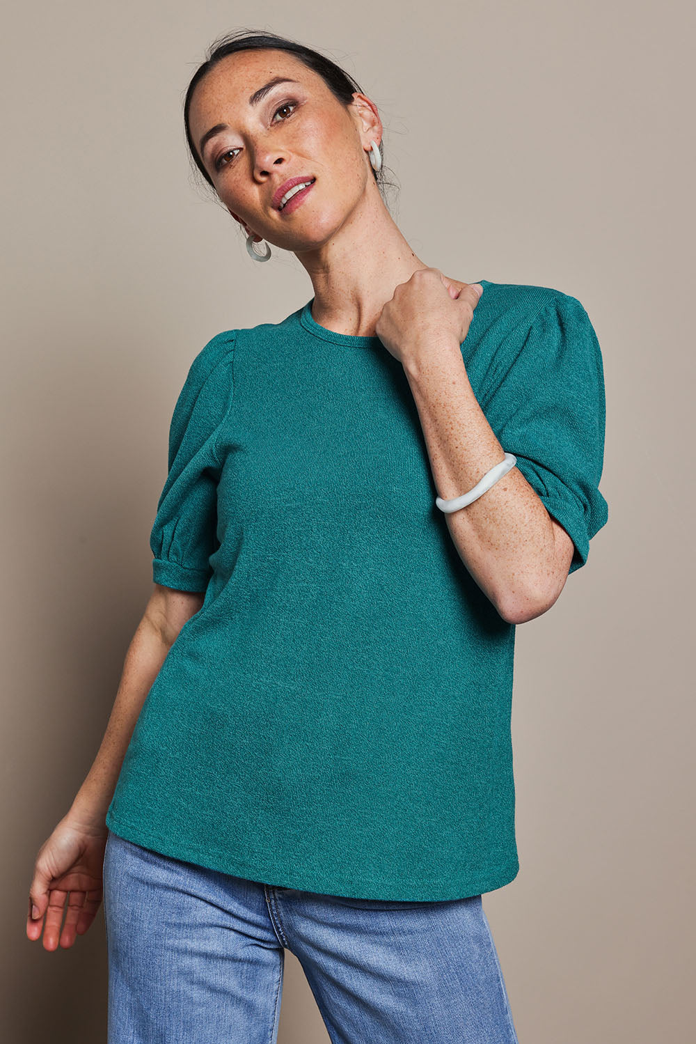 Model Katie wearing size 10 of the Gathered Sleeve Top in colour Jade (Green), from the front, cropped image